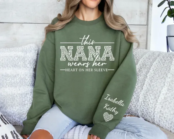 1.jpeg Custom Nana Sweatshirt, With Kids Name On Sleeve, This Nana Wears Her Heart On Her Sleeve