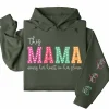 10-5-1.webp This Mama Wears Her Heart on Her Sleeve Hoodie – Custom Kids Names, Mother's Day