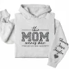 18-4-4.webp This Mom Wears Her Heart on Her Sleeve Hoodie – Personalized Mom Life Shirt with Kids’ Names, Mother’s Day Gift, Cute Blessed Mama Tee