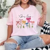 She Is Mom T-Shirt – Retro Coquette Bow Christian Mom Shirt, Bible Verse 'She Is Strong' Tee, Cute Mother's Day Gift for Faithful Mama