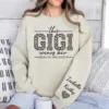 Custom Gigi Sweatshirt, Custom Grandma Gift, This Gigi Wears Her Heart On Her Sleeve Sweater, With Kids' Names On Sleeve, Gigi Gift on Mother's Day