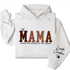 Custom This Mama Wears Her Heart On Her Sleeve Hoodie – Personalized Mom Shirt, Mother’s Day Gift for New Moms