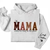 4-4-7.webp Custom This Mama Wears Her Heart On Her Sleeve Hoodie – Personalized Mom Shirt, Mother’s Day Gift for New Moms