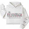 This Grandma Wears Her Heart on Her Sleeve Hoodie – Custom Hoodie with Kids’ Names, Personalized Mother’s Day Gift for Grandma