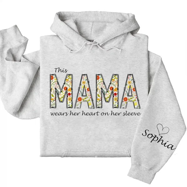 7-1-9.webp This Mama Wears Her Heart on Her Sleeve Hoodie – Floral Hoodie for Mom with Kids’ Names, Cute Personalized Gift Idea