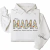 7-3-9.webp This Mama Wears Her Heart on Her Sleeve Hoodie – Floral Hoodie for Mom with Kids’ Names, Cute Personalized Gift Idea