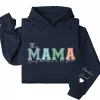 8-2-8.webp This Mama Wears Her Heart on Her Sleeve Hoodie – Custom Hoodie with Kids’ Names, Personalized Mother’s Day Gift for Mama