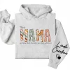 9-4-5.webp This Mama Wears Her Heart on Her Sleeve Hoodie – Custom Kids Names Hoodie for Mom
