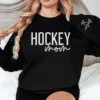 CUSTOM-Hockey-Mom-Sweatshirt-with-Name-on-Sleeve-Ice-Hockey-Mama-Sweater-Personalized-Hockey-Gift-Game-Day-Crewneck-Goalie-Mom-Hoodie-2.png Custom Hockey Mom Sweatshirt with Name on Sleeve, Personalized Mom Sweater, Game Day Shirt, Crewneck, Mothers Day Gift