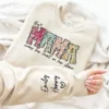 Custom-Mama-Sweatshirt-with-Kid-Name-This-Mama-Wear-Her-Heart-On-Her-Sleeve-Sweatshirt-Personalized-Mom-Shirt-With-Names-Mothers-Day-Gift-1.jpg Custom Mama Shirt, Heart on Sleeve, Personalized Gift for Mom