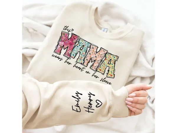 Custom-Mama-Sweatshirt-with-Kid-Name-This-Mama-Wear-Her-Heart-On-Her-Sleeve-Sweatshirt-Personalized-Mom-Shirt-With-Names-Mothers-Day-Gift-1.jpg Custom Mama Shirt, Heart on Sleeve, Personalized Gift for Mom