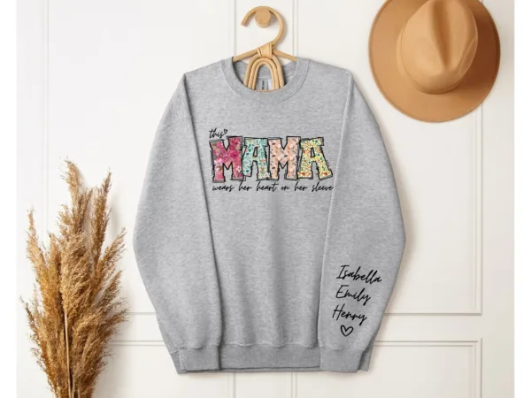 Custom-Mama-Sweatshirt-with-Kid-Name-This-Mama-Wear-Her-Heart-On-Her-Sleeve-Sweatshirt-Personalized-Mom-Shirt-With-Names-Mothers-Day-Gift-2.jpg Custom Mama Shirt, Heart on Sleeve, Personalized Gift for Mom