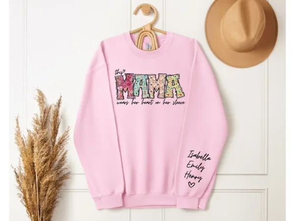 Custom-Mama-Sweatshirt-with-Kid-Name-This-Mama-Wear-Her-Heart-On-Her-Sleeve-Sweatshirt-Personalized-Mom-Shirt-With-Names-Mothers-Day-Gift-3.jpg Custom Mama Shirt, Heart on Sleeve, Personalized Gift for Mom