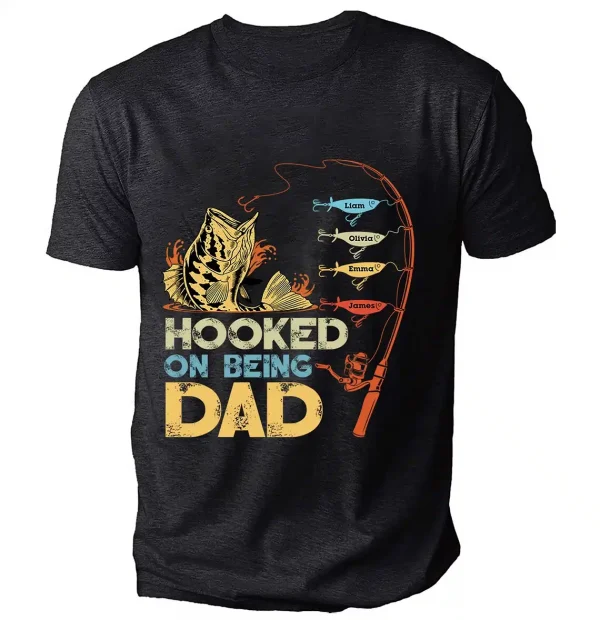 Personalized-Hooked-On-Being-Dad-Fishing-Shirts-4.webp Personalized Hooked On Being Dad Fishing Shirts, Vintage Dad Shirt, Best Dad T-Shirt, Funny Fishing Shirts For Men, Gifts For Fisherman