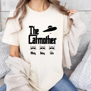 The-Catmother-T-Shirt-Cat-Mum-T-Shirt-Cat-Mama-Tee-Cat-Lovers-Top-Funny-Cat-Mum-Tshirt-Personalized-Cat-Names-Tee.webp The Catmother T-Shirt, Cat Mum T Shirt, Cat Mama Tee, Cat Lovers Top, Funny Cat Mum T-shirt, Personalized Cat Names Tee